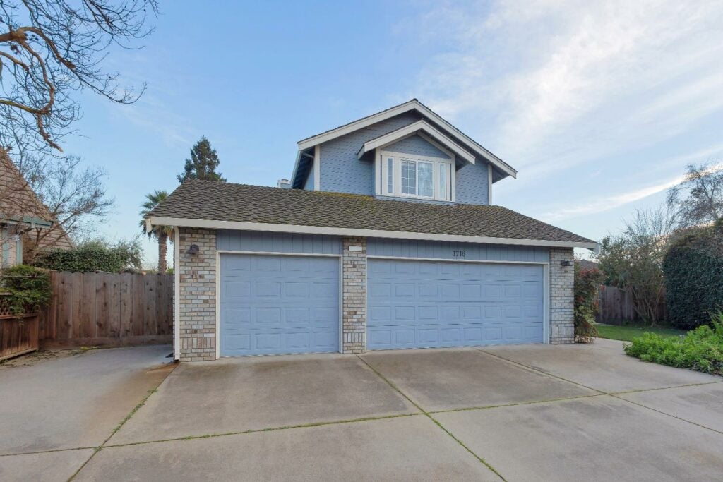 Real Estate Property, image of house with blue painted garage doors